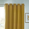 Close up of mustard curtains in eyelet style