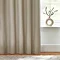 Close up of natural coloured curtain brushing the floor