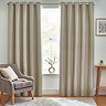 Floor length natural coloured curtains open in front of window