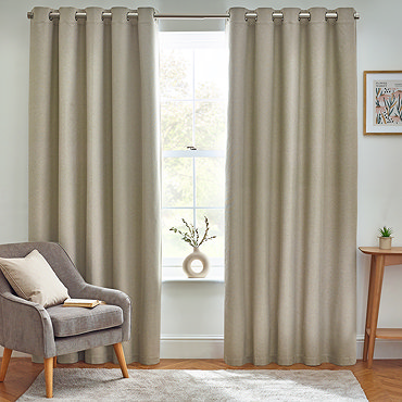 Close up of natural coloured curtains in eyelet style