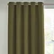 Close up of olive green curtains in eyelet style