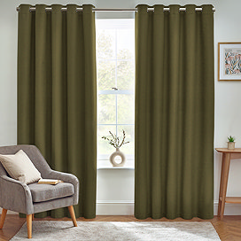 Olive green floor length curtains open in front of window in living room