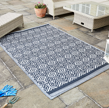 image cut out on white background of black and white geometric rug