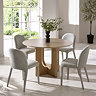 image of round oak dining table with four grey chairs around it