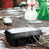 image of black rectangular electrical connection box outside in snow