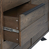 close up image of sideboard middle drawer pulled out to show hinge function, and sleek black pull-out handle