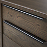 close up image of dark oak panelled front drawers of large sideboard, highlighting wood grain effect and sleek pull-out metal handles on the drawers