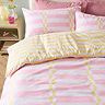Lottie Yellow and pink duvet cover set on bed image 1