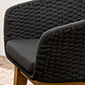close up image of material of black dining chair