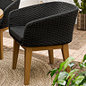 image of black garden dining chair with textured back and plush seat cushion