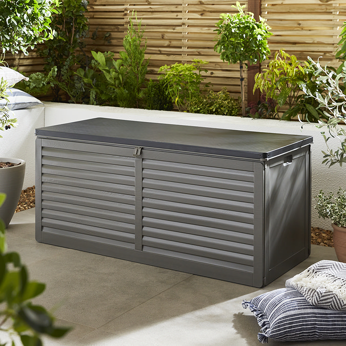 image of large rectangular storage box against cream wall in a garden