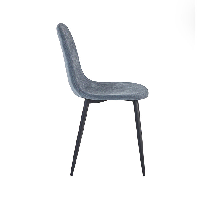 side on image cut out on white background of denim blue chenille dining chair with curved seat and black legs
