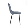 side on image cut out on white background of denim blue chenille dining chair with curved seat and black legs
