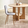 image of grey chenille dining chair round an oak table on wooden flooring