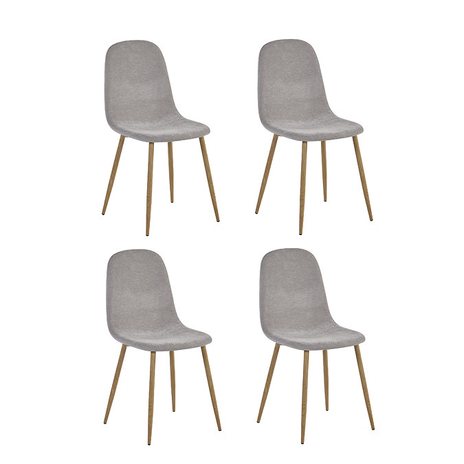 image cut out on white background of four modern chenille dining chairs with light wood legs