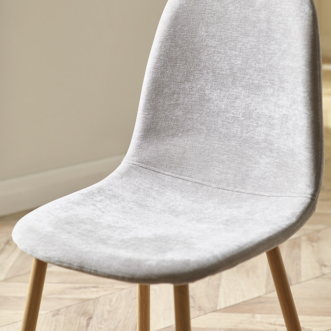 close up image of grey chenille seat of dining chair