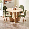 image of four olive green chenille chairs round an oak dining table, on wooden chevron flooring in front of a long window