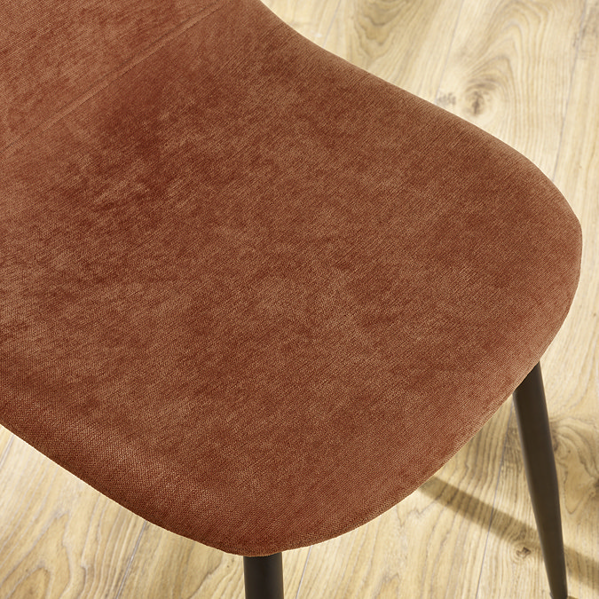 close up on terracotta orange chenille chair seat