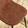 close up on terracotta orange chenille chair seat
