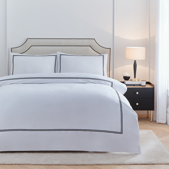 Elara on bed image 1