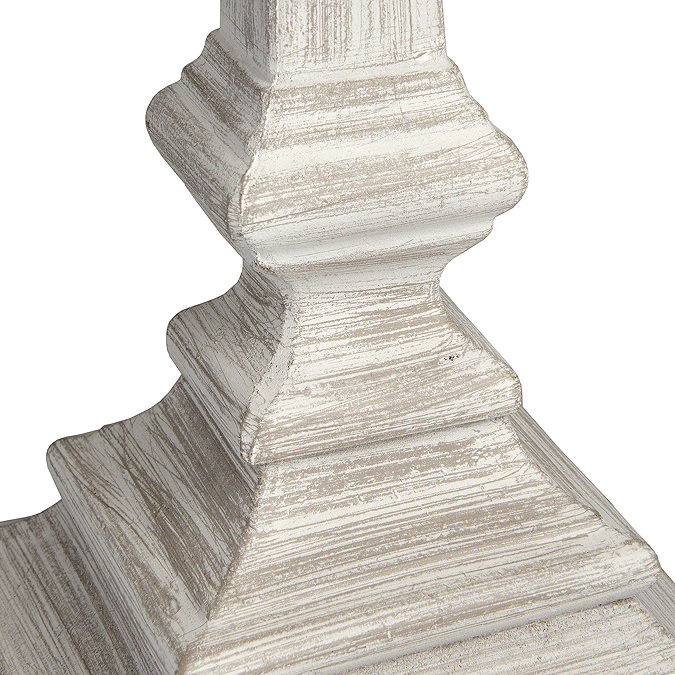 close up image of washed wood material of sculpted table lamp