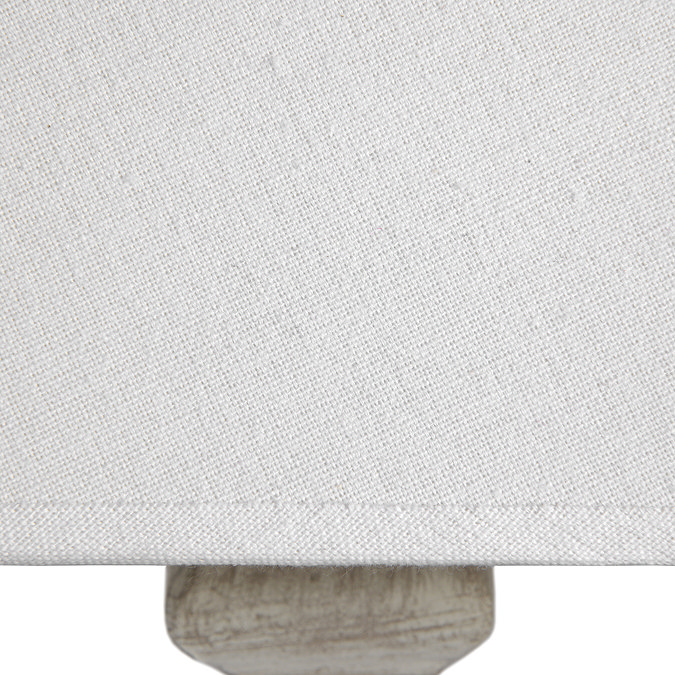 close up image of linen material of table lamp shade