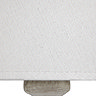 close up image of linen material of table lamp shade