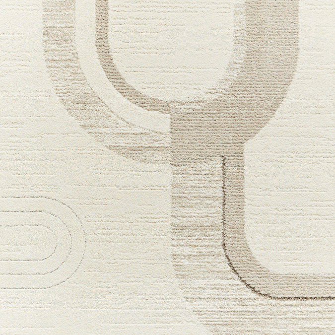 close up on beige pattern of rug