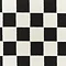 close up on black and white checkered pattern of rug