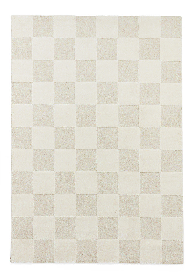 image cut out on white background of cream checkered rextangle rug