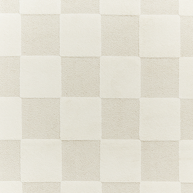 close up image of cream checkered pattern and texture of rug