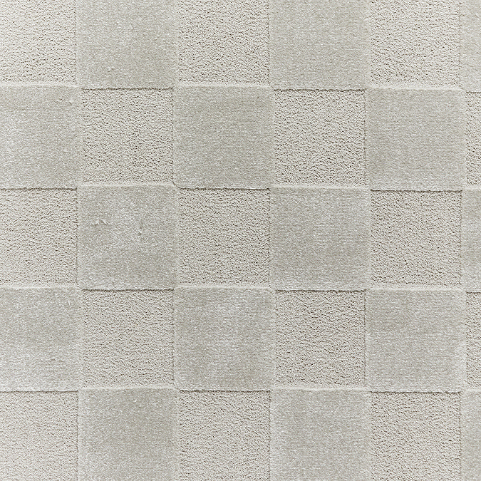 close up image of colour and texture of silver checkered rug