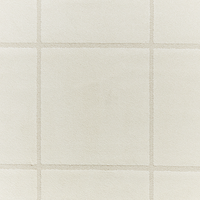 close up on colour and texture of cream coloured lined rug