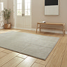 angled image of silver rug with line detail, on light wooden flooring