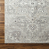 close up swatch image of dusty sage green vintage area rug, focus on colour and texture