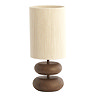 image cut out on white background of brown lamp with rounded base and cylindrical natural shade