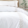 Embroidery Leaf duvet cover set close up on bed image 4