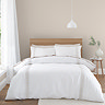Embroidery Leaf duvet cover set on bed image 1