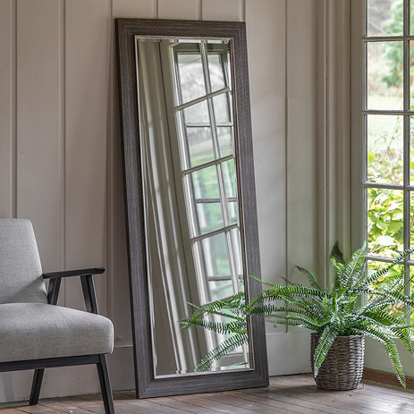 image of pewter grey freestanding mirror against wall