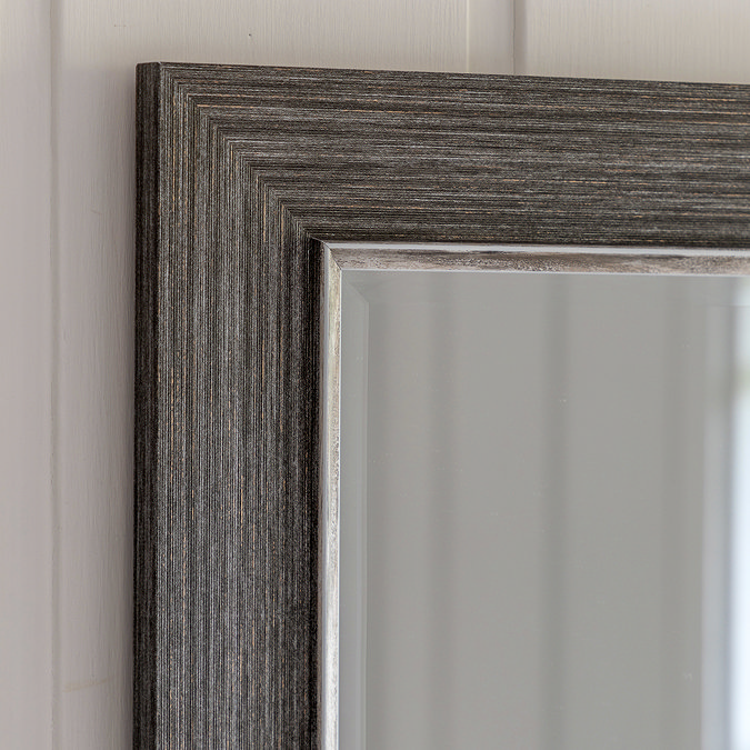 close up image of corner of pewter grey wall mirror