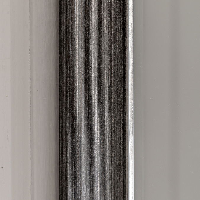 close up on pewter grey frame of wall mirror