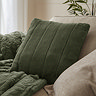 pine green faux fur square cushion on sofa