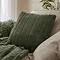 pine green faux fur square cushion on sofa