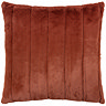 cut out of rust coloured faux fur cushion