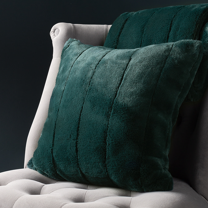 Empress Cushion Emerald on a Grey Chair Front View