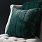 Empress Cushion Emerald on a Grey Chair Front View