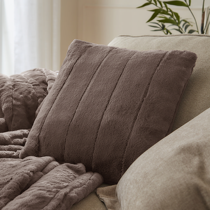 taupe coloured square cushion on sofa