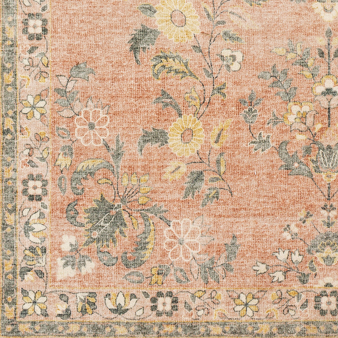 close up swatch image of floral rug in shades of pink, orange, yellow, grey