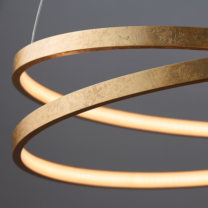 close up on circular abstract shape of scribble pendant light in gold