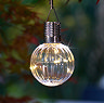 close up image of orb light on a string